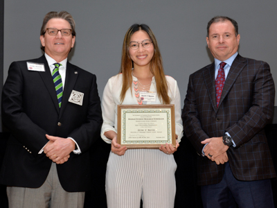 Dr. J. Sedgie Newsom, left, Hinman Dental Society president, and Dr. Jeffrey Brooks, University of Tennessee College of Dentistry executive associate dean, congratulate Jolie Nguyen for receiving the Basic Science Research Award.
